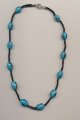 Unique handcrafted necklace made of hand made blue glass eyebeads from India and small oblique cut drawn black glass beads, 1990's, length 17'' 42cm.